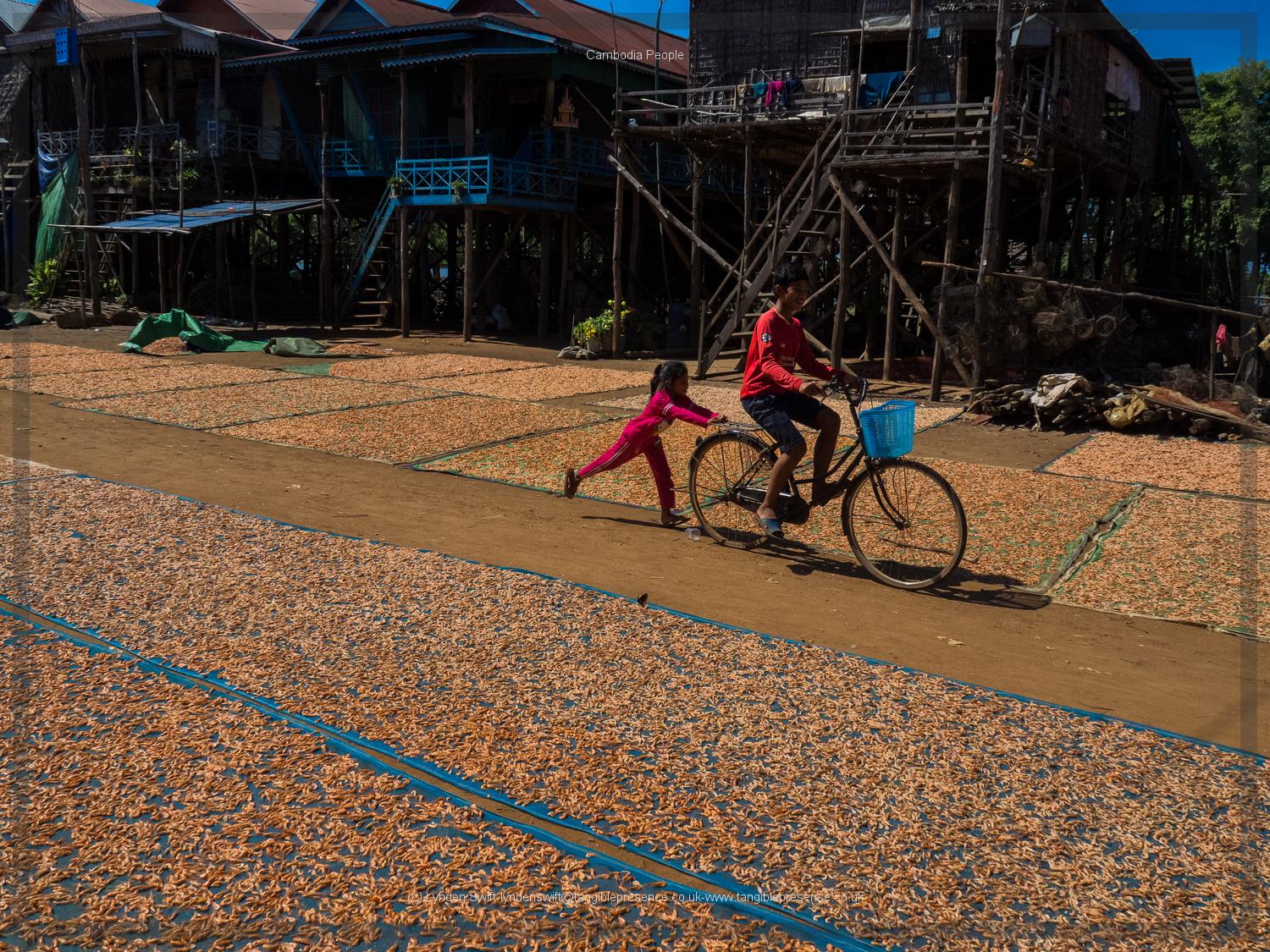  Children and bicycle. Cambodia. Lynden Swift. Tangible Presence Photography. 