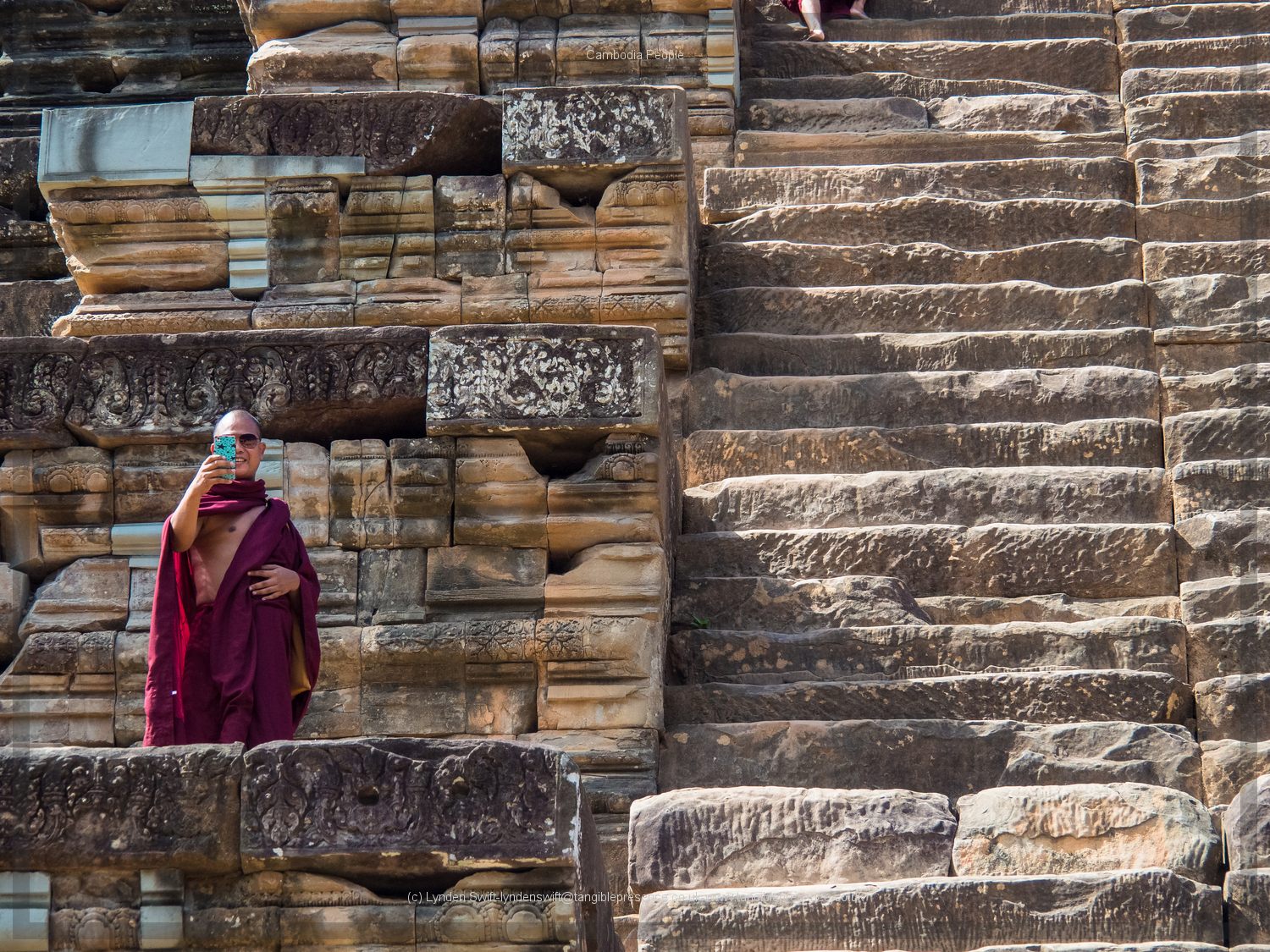  Monk taking selfie. Cambodia. Lynden Swift. Tangible Presence Photography. 