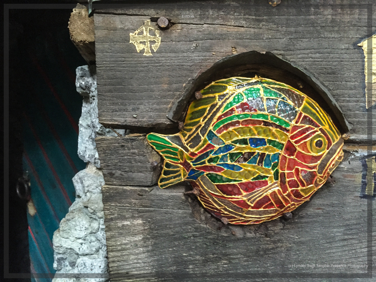  Fish in doorway to monastry.  Estonia. Tallinn. Lynden Swift Tangible Presence Photography. 