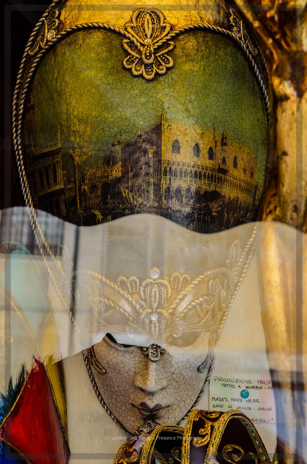  Mask in show window. Venice. Lynden Swift. Tangible Presence Photography.  